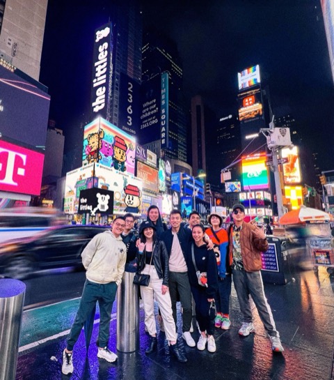 The team under the littles' Times Square billboard, NFT NYC 2022